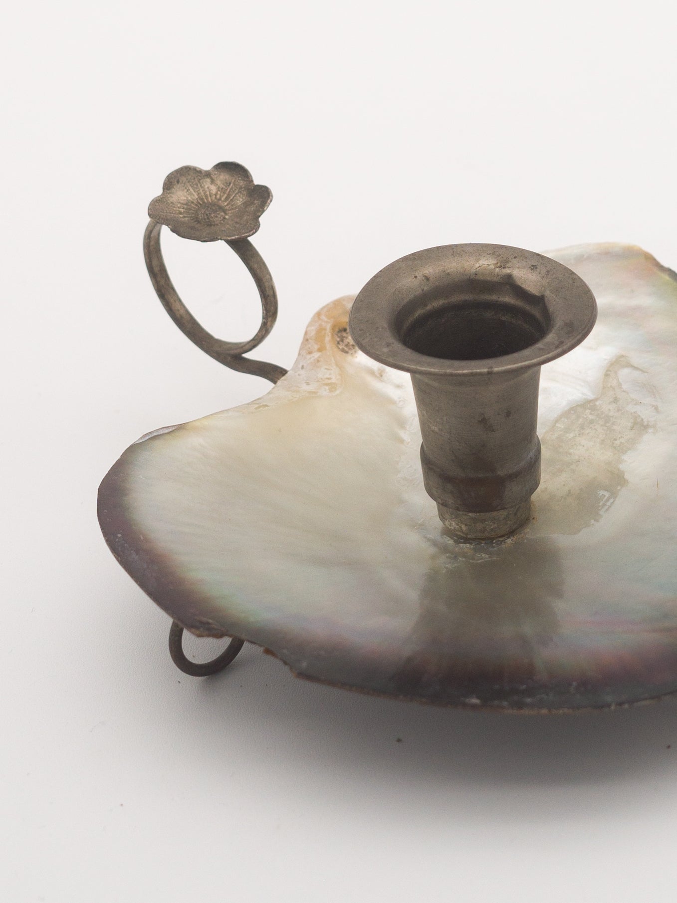 Shell footed candle holder
